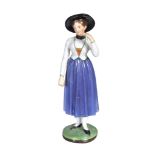 A Moscow porcelain (Gardner) figure of a woman, circa 1830, 18.5cm high