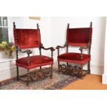 A pair of William and Mary carved walnut armchairs, circa 1690, each rectangular padded back