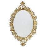 A gilt metal wall mirror, mid 19th century, the oval plate with a pierced frame cast with leafy