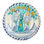 An English delft ­am and Eve' charger, of Brislington type, circa 1690-1700, painted in tones of