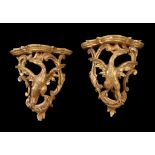 A pair of George III carved giltwood wall brackets , circa 1770, each shaped shelf above the Ho-Ho