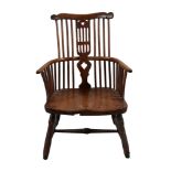 An ash, elm and fruitwood Windsor armchair, mid 18th century, the rectangular spindle back with