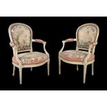 A pair of Louis XVI grey painted armchairs, circa 1775, each with a tapestry upholstered back and