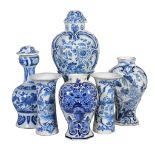 A selection of Dutch Delft , 18th and 19th century, comprising: a pair of waisted sleeve vases with