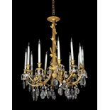 A gilt metal and cut glass twelve light chandelier in late 18th century taste, late 19th/ early