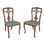 A pair of Anglo-Indian hardwood side chairs , 19th century, carved throughout with flowers, each