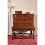 A William and Mary olivewood oyster veneered chest on stand, circa 1690, the rectangular top with