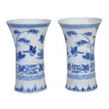 A pair of Chinese porcelain blue and white transitional vases , 17th century, of stylized gu form,