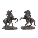 After Guillaume Coustou the Elder, (French 1677 ~ 1746), a pair of patinated bronze models of the