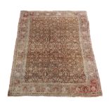 A Bidjar carpet , the dark ochre field decorated profusely with detailed foliate motifs throughout,