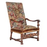 A Louis XIV carved walnut armchair, late 17th/ early 18th century, the rectangular back and seat