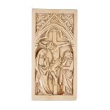 Ω A French carved ivory rectangular diptych panel, the Crucifiction, 14th century, traditionally