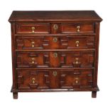 A Charles II solid yew chest of drawers, circa 1660, the rectangular top with a moulded edge above