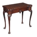 A George II mahogany folding card table, circa 1750, the folding top with rounded outset front