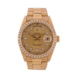 Rolex, Oyster Perpetual Day-Date, ref. 18038, an 18 carat gold and aftermarket diamond set bracelet