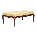 A mid-Victorian mahogany centre stool , circa 1860, the upholstered top above frieze with central