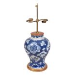 A Chinese blue and white baluster vase , 19th century, painted with quatrefoil panels of precious