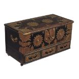 A Zanzibar metal mounted and studded hardwood coffer, of small proportion, on later castors, 60cm