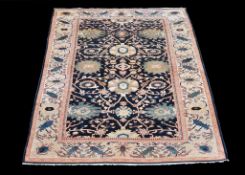 A woven carpet , in Zeigler Mahal style, 20th century, with perfuse floral decoration,