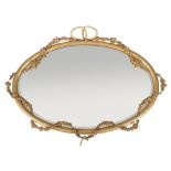 A Victorian giltwood and composition wall mirror, circa 1870, the oval plate surrounded by applied