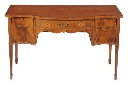 Ω A George III mahogany and rosewood banded serpentine fronted sideboard , circa 1790, with