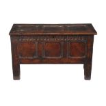 An oak three panel chest , mid-17th century, the hinged lid opening to large compartment, 64cm