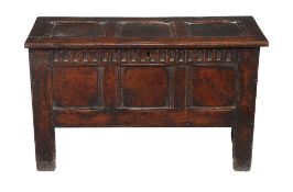 An oak three panel chest , mid-17th century, the hinged lid opening to large compartment, 64cm