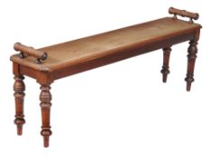A Victorian mahogany hall bench, circa 1880, with ring turned rests and on conforming legs, 53cm