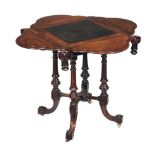 Ω A Victorian rosewood games table, circa 1860, the leather inset top with a hinged leaf to each