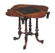 Ω A Victorian rosewood games table, circa 1860, the leather inset top with a hinged leaf to each