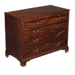 A George III mahogany chest of drawers, circa 1780, with brushing slide above two short and three