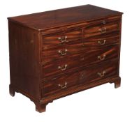 A George III mahogany chest of drawers, circa 1780, with brushing slide above two short and three
