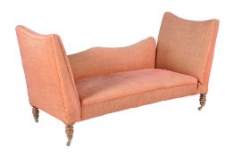 A Victorian walnut and upholstered daybed , late 19th century, in pink upholstery, with one drop