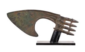 A Luristan spike butted bronze axe head, circa 700 B.C., of typical form, with curved blade, ribbed
