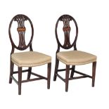 A pair of mahogany dining chairs in George III style , early 20th century, and a further pair of
