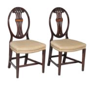 A pair of mahogany dining chairs in George III style , early 20th century, and a further pair of