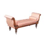 A mid-Victorian window seat , circa 1860, with outscrolled rests above the removable seat, and on
