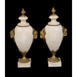 A pair of Continental white marble and gilt metal mounted urns in Louis XVI taste, late 19th