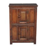 An oak mural type cupboard , late 17th century/ early 18th century and later, with double panelled