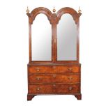 A burr walnut and crossbanded wardrobe containing some 18th century elements mirror panelled doors