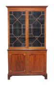 A Regency mahogany cabinet bookcase, circa 1815, 218cm high, 125cm wide, 49cm deep