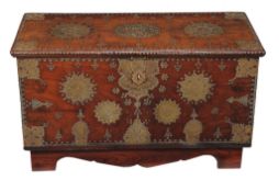 A Zanzibar metal mounted and studded hardwood coffer , of small proportion, on a later plinth base,