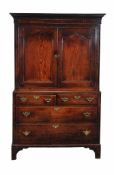 A George III oak cupboard , circa 1780, the panel doors enclosing a shelf, the base with two short