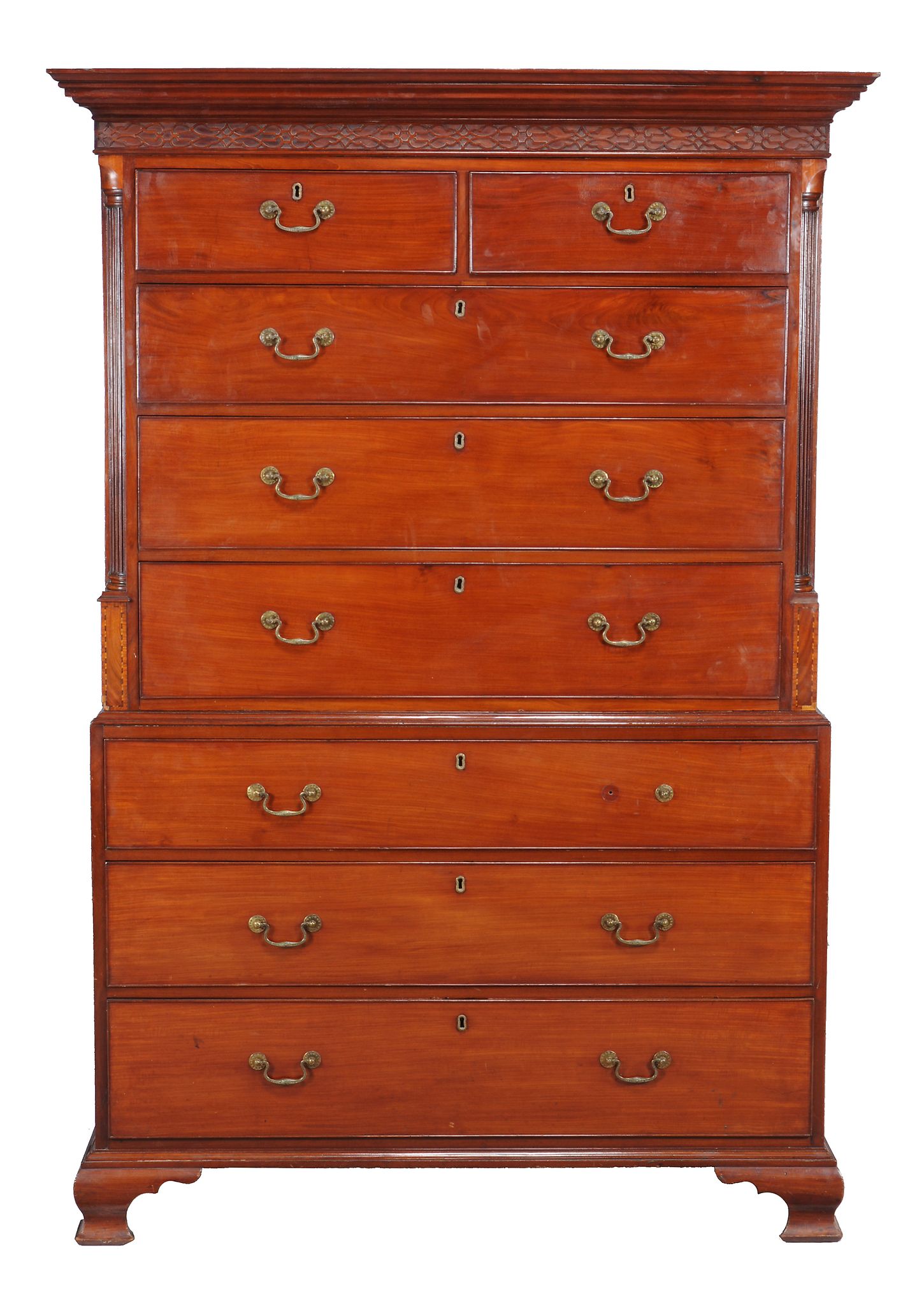 A George III mahogany chest on chest, circa 1780, with blind fretwork frieze and flanking reeded