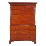 A George III mahogany chest on chest, circa 1780, with blind fretwork frieze and flanking reeded