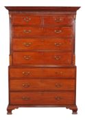 A George III mahogany chest on chest, circa 1780, with blind fretwork frieze and flanking reeded