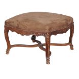 A carved walnut stool in Louis XV style , 20th century, in nubuck style upholstery, the shaped seat