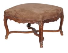 A carved walnut stool in Louis XV style , 20th century, in nubuck style upholstery, the shaped seat