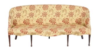 A sofa in George III style, early 20th century, of serpentine outline, 90cm high, 200cm wide, 68cm
