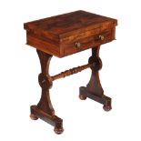 Ω An early Victorian rosewood games table , circa 1840, the hinged rectangular top opening to a